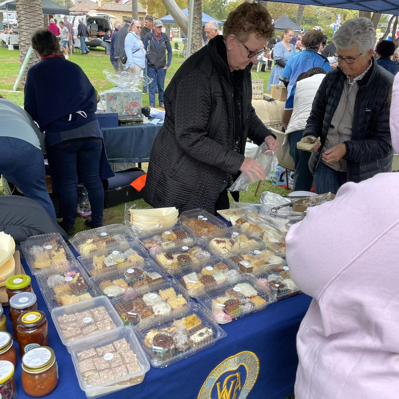 A woman serving food at the CWA Stall at last years inernational food fair